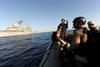 Gulf of Aden: Members of the visit, board, search and seizure team of the guided-missile cruiser USS San Jacinto (CG 56) wait for instructions to resume counter piracy operations.